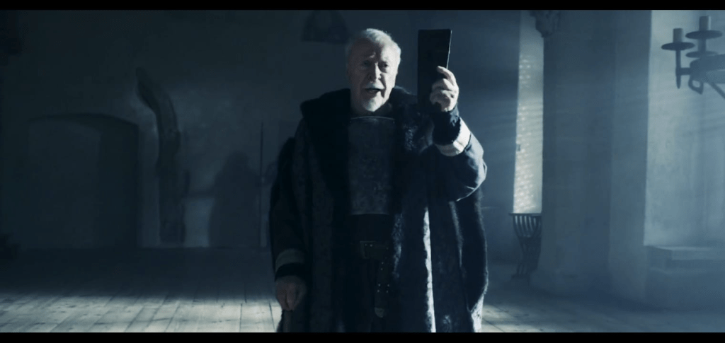 Michael Caine making an entrance to the King's court